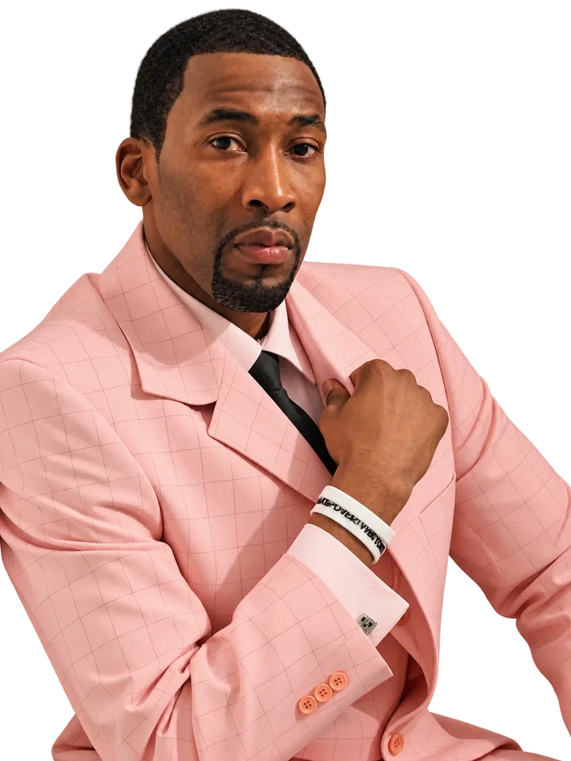 Cory McGee in a pink checked suit, entrepreneur and consultant