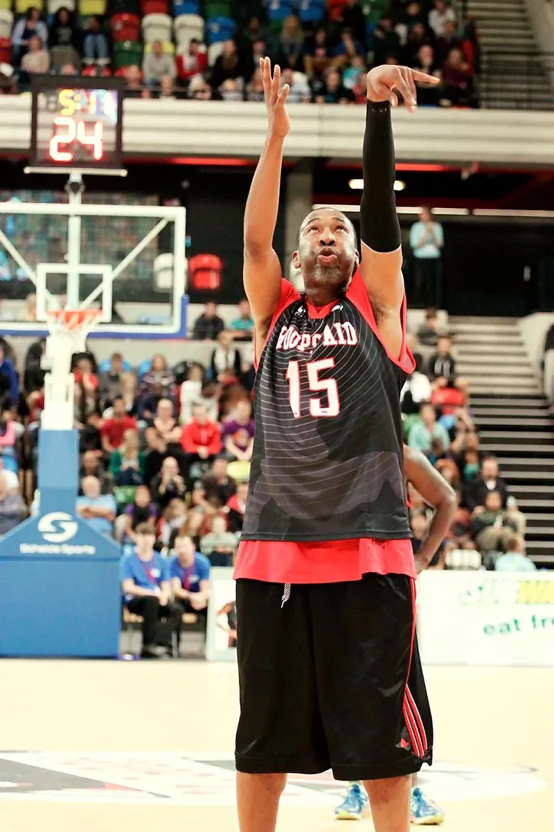 Cory McGee shooting a free throw in a professional basketball arena