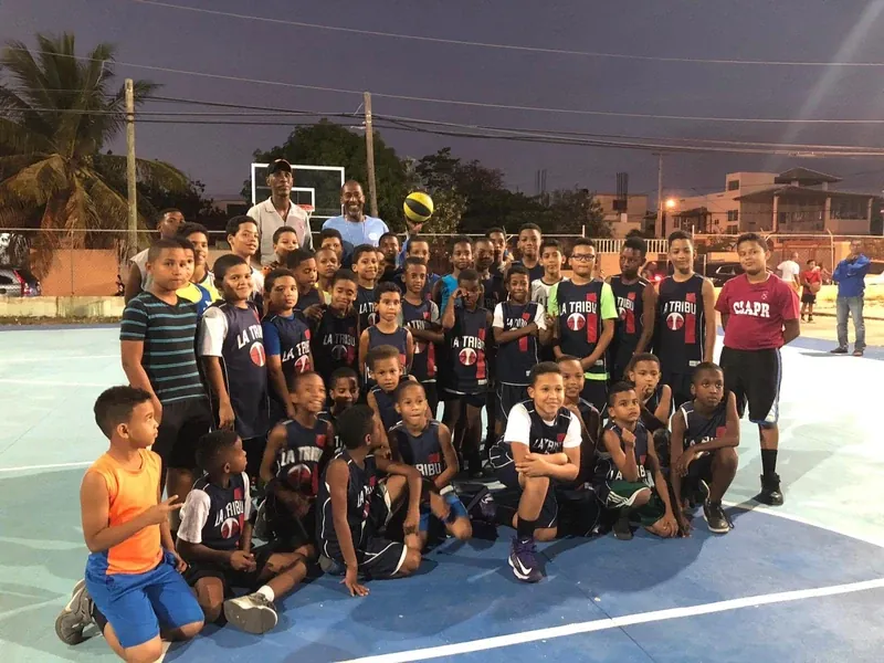 Night-time youth basketball session on an outdoor court | Cory McGee